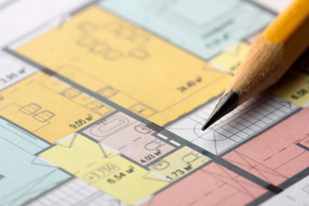 Close-up of pencil on architectural floor plan